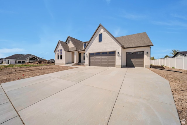 1910 W Bonneville Ln, Kaysville, UT 84037 - modern farmhouse with fence, driveway, a shingled roof, and a garage