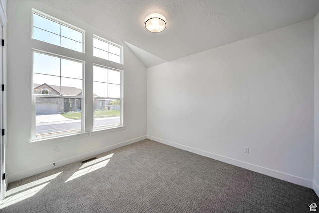 1910 W Bonneville Ln, Kaysville, UT 84037 - empty room with lofted ceiling, visible vents, carpet flooring, and baseboards