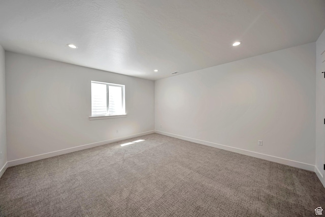 1910 W Bonneville Ln, Kaysville, UT 84037 - spare room featuring baseboards, recessed lighting, and light carpet