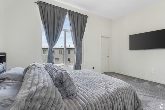 carpeted bedroom with baseboards