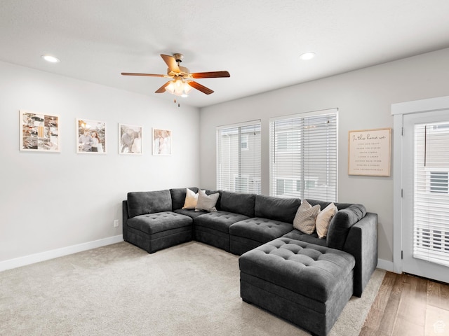 living area featuring ceiling fan, baseboards, and recessed lighting