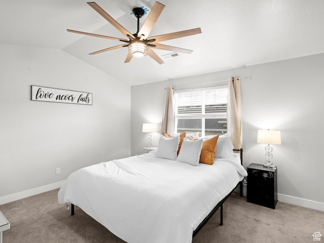 bedroom featuring lofted ceiling, carpet floors, baseboards, and visible vents