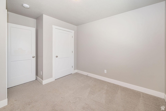 2276 W 2625 S Unit 110, West Haven, UT 84401 - unfurnished bedroom featuring baseboards and light colored carpet