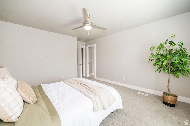 2276 W 2625 S Unit 110, West Haven, UT 84401 - bedroom featuring baseboards, a ceiling fan, visible vents, and light colored carpet