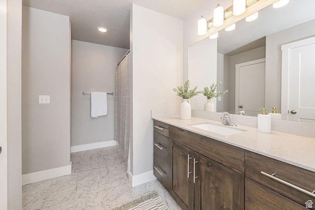 2276 W 2625 S Unit 110, West Haven, UT 84401 - bathroom featuring vanity, marble finish floor, baseboards, and a shower