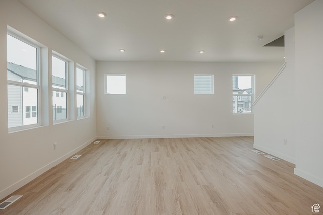 3651 N Oak Blvd Unit 337, Eagle Mountain, UT 84005 - spare room featuring a wealth of natural light, visible vents, light wood finished floors, and baseboards