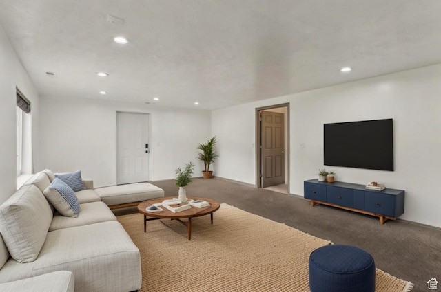 carpeted living area with recessed lighting