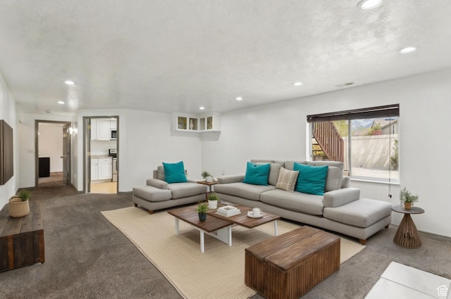 carpeted living room featuring recessed lighting