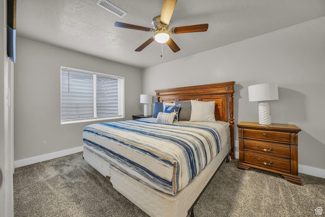 carpeted bedroom featuring baseboards, visible vents, and ceiling fan