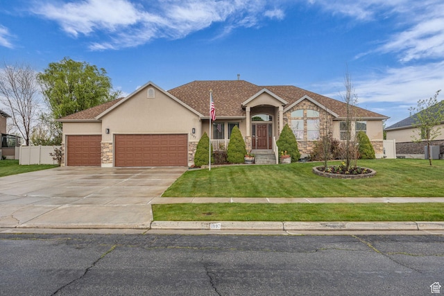 ranch-style home with driveway, an attached garage, fence, a front yard, and stucco siding