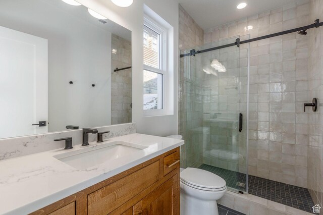 496 E Kayak Dr Unit 306, Hideout, UT 84036 - bathroom with tile patterned floors, a stall shower, toilet, recessed lighting, and vanity