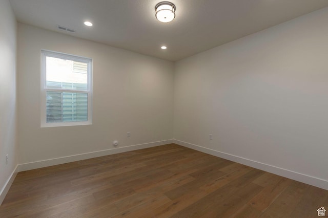 496 E Kayak Dr Unit 306, Hideout, UT 84036 - unfurnished room featuring visible vents, wood finished floors, and baseboards