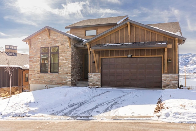 496 E Kayak Dr Unit 306, Hideout, UT 84036 - view of front of house featuring stone siding, board and batten siding, and a garage