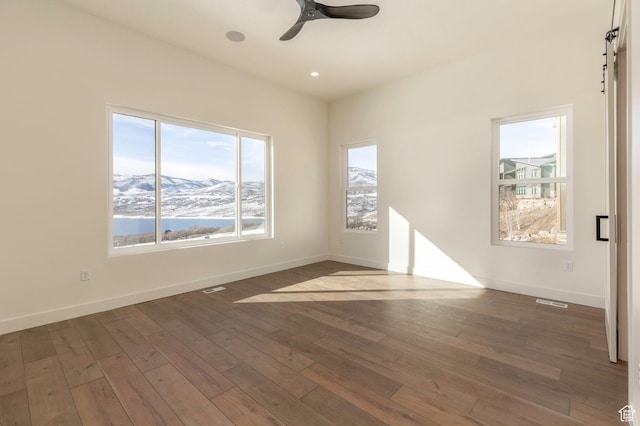 496 E Kayak Dr Unit 306, Hideout, UT 84036 - empty room featuring ceiling fan, baseboards, dark wood-style flooring, visible vents, and recessed lighting