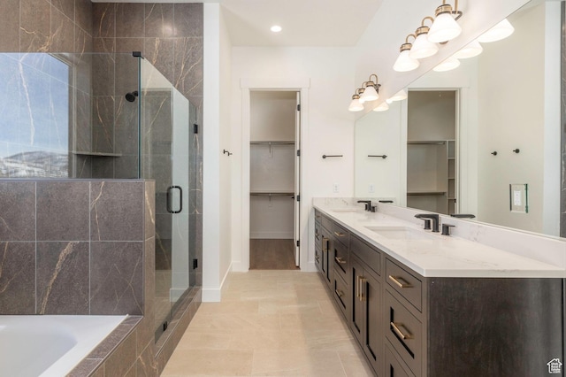 496 E Kayak Dr Unit 306, Hideout, UT 84036 - full bathroom with a walk in closet, a sink, double vanity, and a stall shower