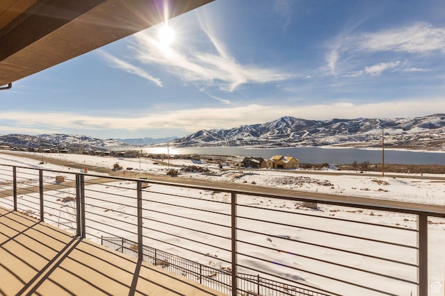 496 E Kayak Dr Unit 306, Hideout, UT 84036 - snow covered back of property with a mountain view