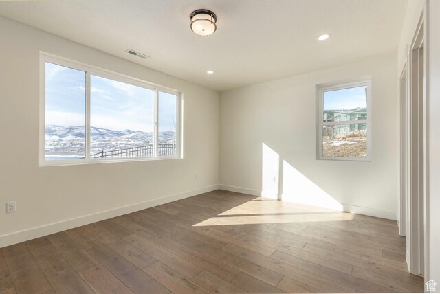 496 E Kayak Dr Unit 306, Hideout, UT 84036 - spare room with plenty of natural light, hardwood / wood-style flooring, and baseboards
