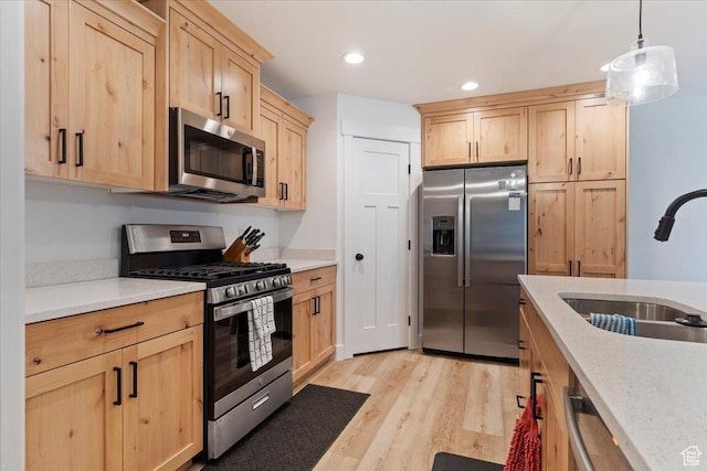 816 E Clover Way, Morgan, UT 84050 - kitchen with recessed lighting, light wood finished floors, stainless steel appliances, light brown cabinets, and a sink