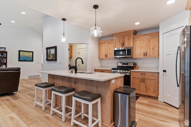 816 E Clover Way, Morgan, UT 84050 - kitchen with light countertops, visible vents, a sink, light wood-type flooring, and appliances with stainless steel finishes