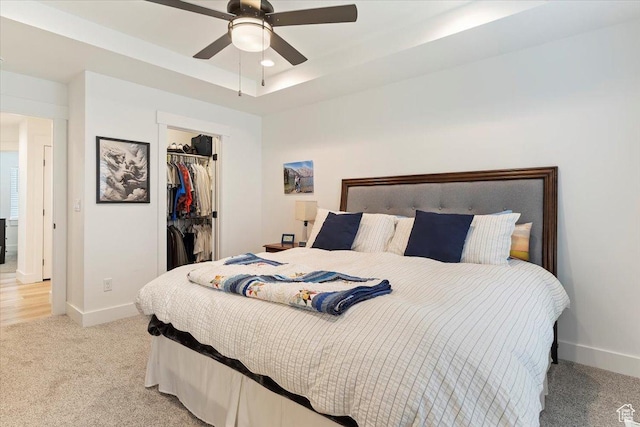 816 E Clover Way, Morgan, UT 84050 - bedroom featuring light carpet, a raised ceiling, a spacious closet, and a ceiling fan