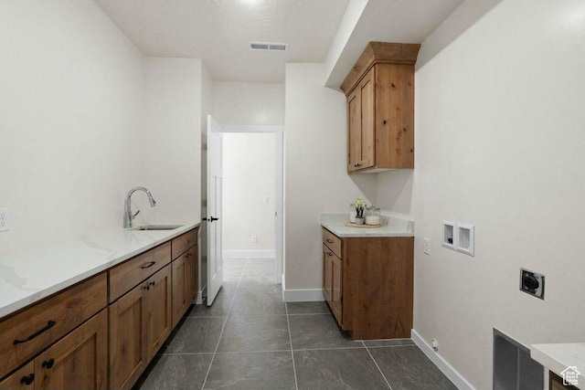 48 N Meadow Dr, Pine Valley, UT 84781 - washroom with visible vents, a sink, hookup for an electric dryer, dark tile patterned flooring, and washer hookup