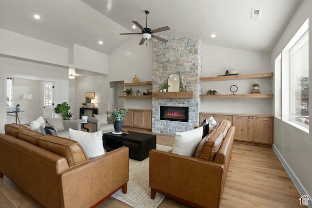 48 N Meadow Dr, Pine Valley, UT 84781 - living room with high vaulted ceiling, light wood-style floors, ceiling fan, a fireplace, and visible vents