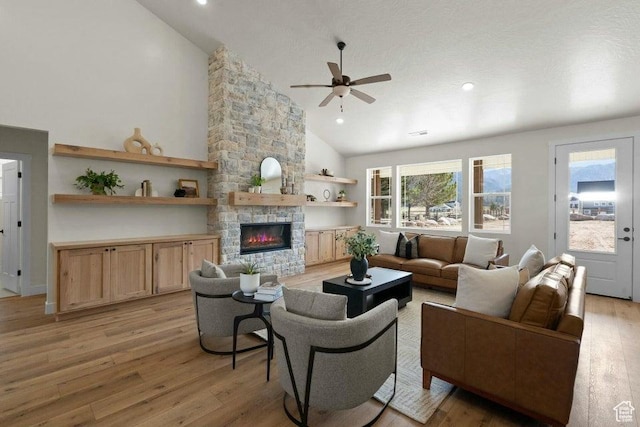 48 N Meadow Dr, Pine Valley, UT 84781 - living area featuring high vaulted ceiling, a stone fireplace, ceiling fan, light wood finished floors, and recessed lighting