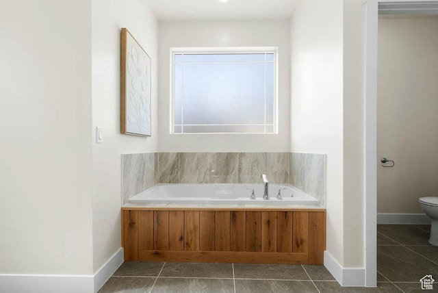 48 N Meadow Dr, Pine Valley, UT 84781 - bathroom with a garden tub, toilet, tile patterned flooring, and baseboards