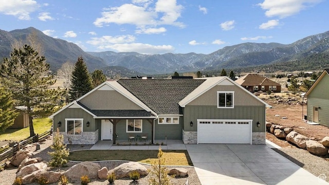 48 N Meadow Dr, Pine Valley, UT 84781 - view of front facade with concrete driveway, a mountain view, and stone siding