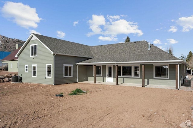 48 N Meadow Dr, Pine Valley, UT 84781 - back of property featuring central air condition unit, roof with shingles, a patio, and dirt driveway