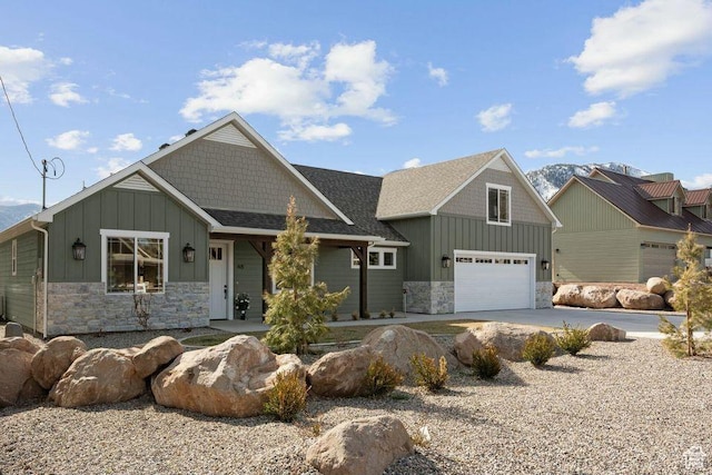 48 N Meadow Dr, Pine Valley, UT 84781 - craftsman house with driveway, stone siding, an attached garage, a shingled roof, and board and batten siding