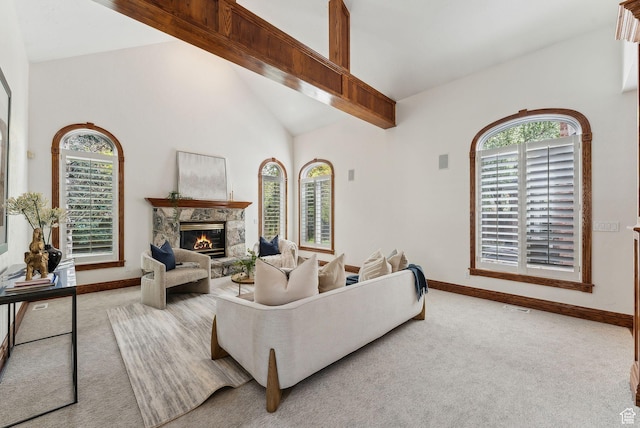 6391 S Shenandoah Park Ave E, Salt Lake City, UT 84121 - living area featuring high vaulted ceiling, baseboards, a stone fireplace, and carpet