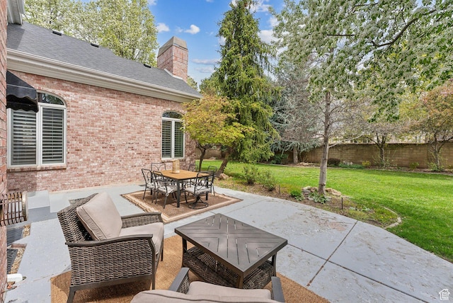 6391 S Shenandoah Park Ave E, Salt Lake City, UT 84121 - view of patio featuring fence, outdoor dining area, and an outdoor living space