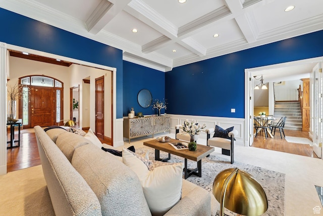 6391 S Shenandoah Park Ave E, Salt Lake City, UT 84121 - living area with a wainscoted wall, coffered ceiling, beamed ceiling, wood finished floors, and ornamental molding