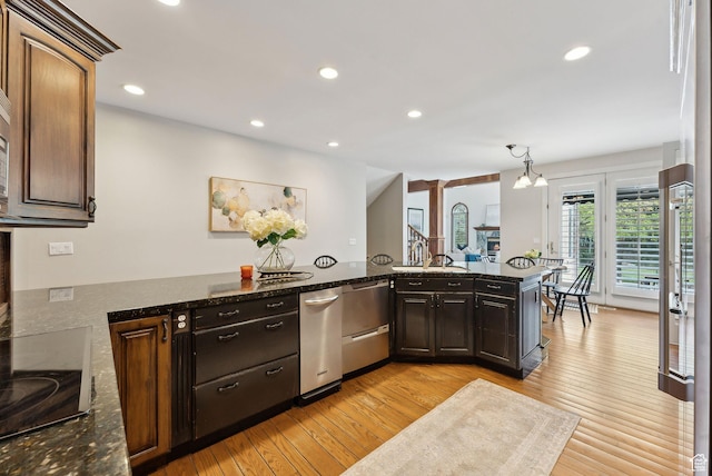 6391 S Shenandoah Park Ave E, Salt Lake City, UT 84121 - kitchen featuring black electric stovetop, light wood finished floors, and recessed lighting