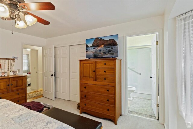 6241 S Barton Park Dr, West Jordan, UT 84081 - bedroom with light colored carpet, ceiling fan, ensuite bathroom, and a closet