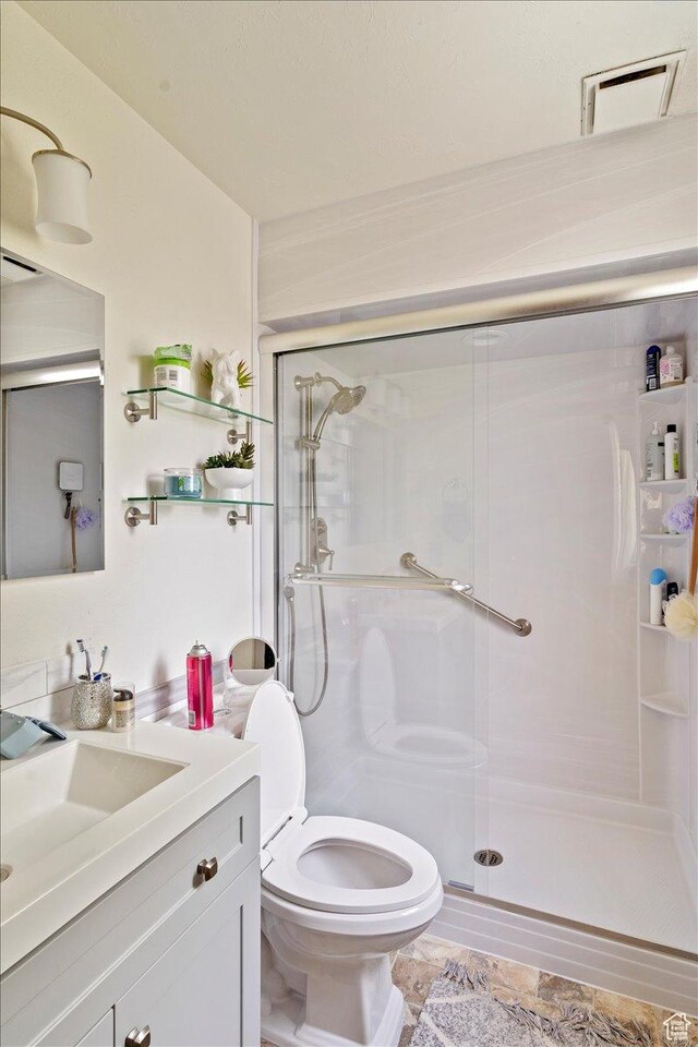6241 S Barton Park Dr, West Jordan, UT 84081 - bathroom with a stall shower, vanity, and toilet