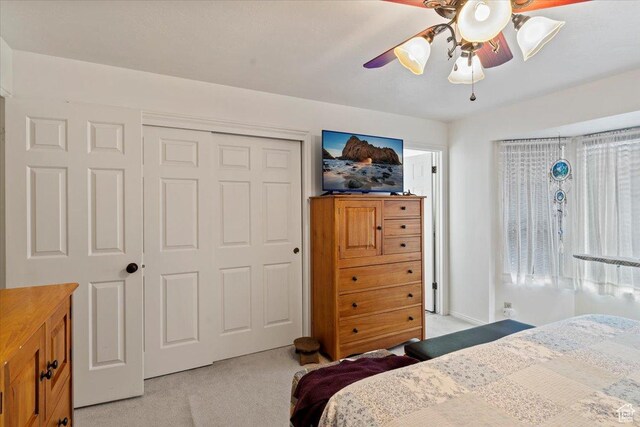 6241 S Barton Park Dr, West Jordan, UT 84081 - bedroom featuring a closet, a ceiling fan, and light carpet