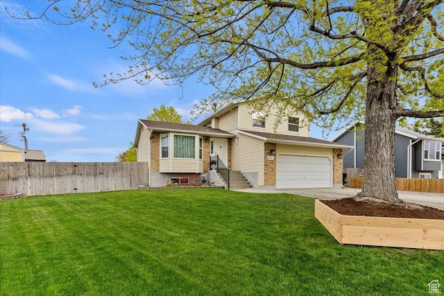 6241 S Barton Park Dr, West Jordan, UT 84081 - split level home featuring concrete driveway, fence, a garage, and a front yard