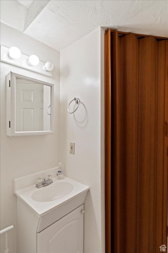 6241 S Barton Park Dr, West Jordan, UT 84081 - bathroom featuring vanity