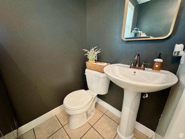 1844 W Heritage Ranch Dr N, Farr West, UT 84404 - half bath featuring tile patterned floors, baseboards, a sink, and toilet
