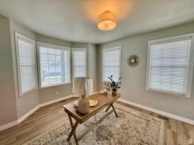 1844 W Heritage Ranch Dr N, Farr West, UT 84404 - office with baseboards, wood finished floors, and a textured ceiling