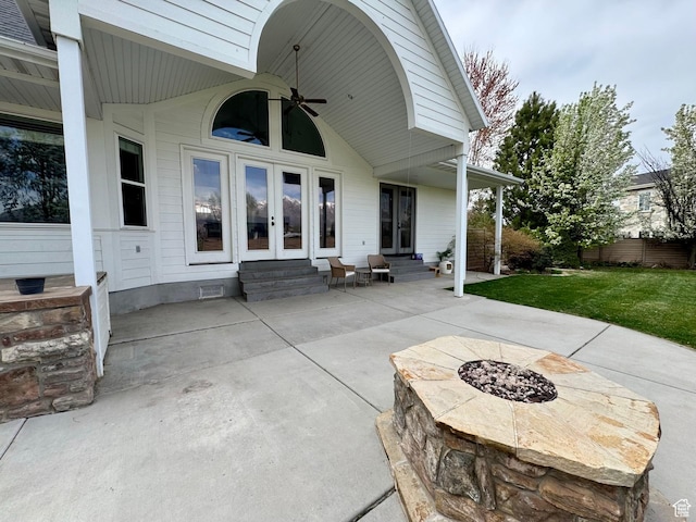 1844 W Heritage Ranch Dr N, Farr West, UT 84404 - view of patio / terrace with entry steps, a ceiling fan, a fire pit, and french doors