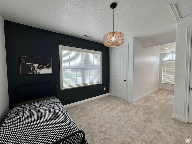 1844 W Heritage Ranch Dr N, Farr West, UT 84404 - bedroom featuring a textured ceiling, visible vents, baseboards, and light carpet