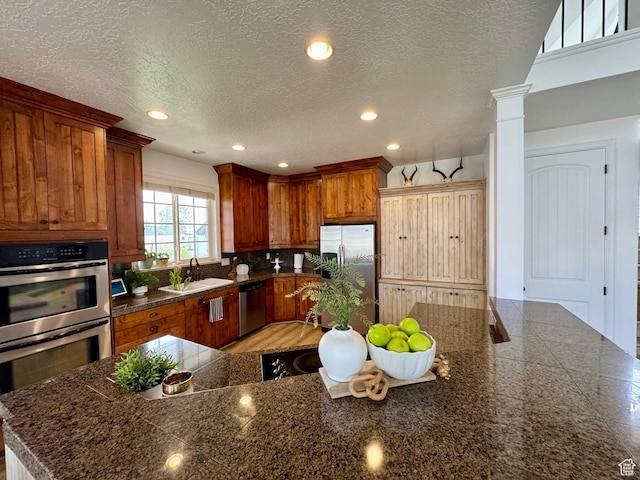 1844 W Heritage Ranch Dr N, Farr West, UT 84404 - kitchen featuring tile countertops, appliances with stainless steel finishes, a sink, and recessed lighting