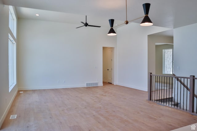 61 N 2430 W Unit 6, Lehi, UT 84043 - empty room featuring light wood-style flooring, baseboards, ceiling fan, recessed lighting, and a high ceiling