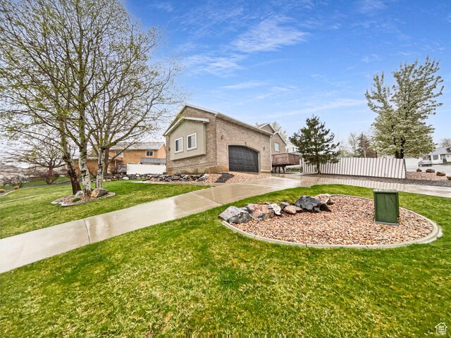 112 E Ama Fille Ln, Payson, UT 84651 - view of front of house with an attached garage, fence, driveway, and a front yard