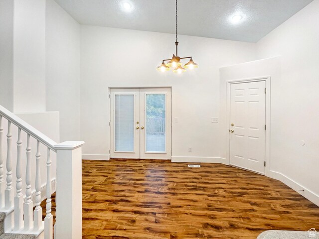 112 E Ama Fille Ln, Payson, UT 84651 - entrance foyer with a chandelier, wood finished floors, baseboards, and french doors
