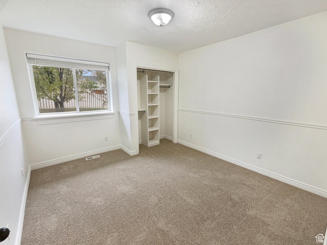 112 E Ama Fille Ln, Payson, UT 84651 - unfurnished bedroom with a textured ceiling, carpet, visible vents, and a closet