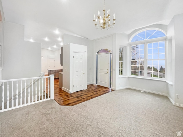 112 E Ama Fille Ln, Payson, UT 84651 - carpeted spare room featuring a chandelier, vaulted ceiling, visible vents, and baseboards